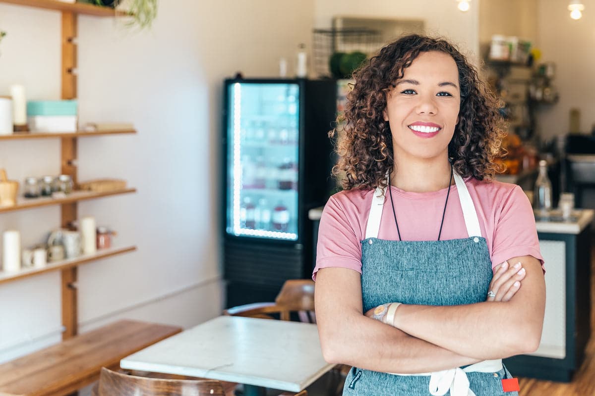 Cafe operator behind the counter